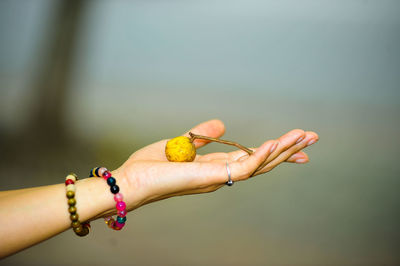 Close-up of woman hand over blurred background