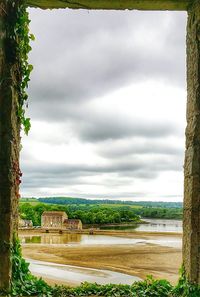 Scenic view of landscape against cloudy sky
