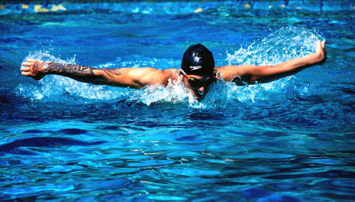 Man swimming in pool