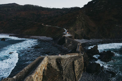 Scenic view of sea by rock formation