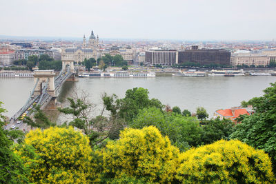 View of bridge over river in city