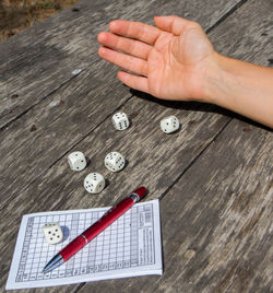 High angle view of hand on table