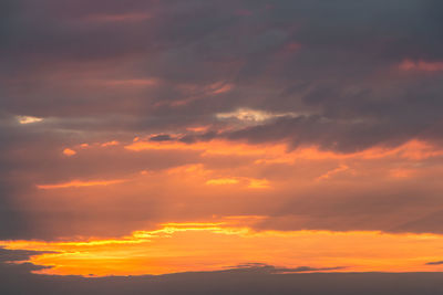 Low angle view of dramatic sky during sunset