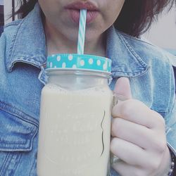 Close-up of woman holding drink