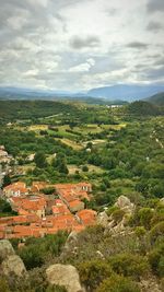 Scenic view of landscape against cloudy sky