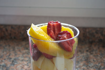 Close-up of strawberry in glass on table