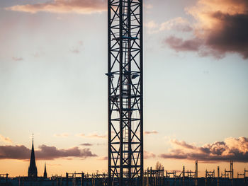 Silhouette tower against sky during sunset