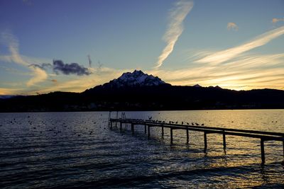 Scenic view of lake against sky during sunset