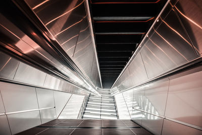 Low angle view of illuminated escalator