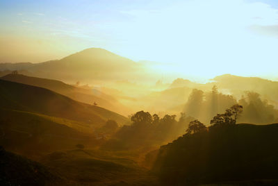 Scenic view of mountains against sky during sunset