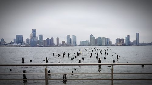 Scenic view of sea and buildings against sky