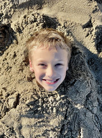 Portrait of smiling boy on land