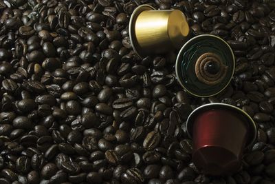 Close-up of coffee beans and cupcakes