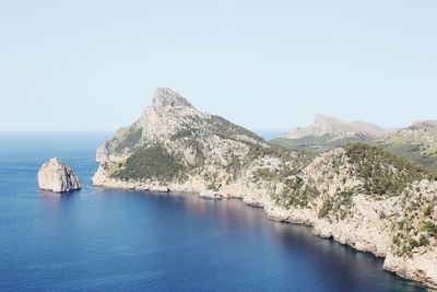 Scenic view of sea with mountain range in background