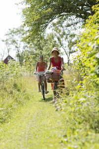 Mature woman with teenage girl cycling, oland, sweden