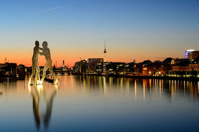 Illuminated buildings at waterfront