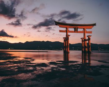 Scenic view of lake against sky during sunset