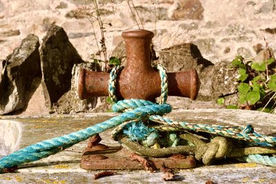 Close-up of rope tied on wood