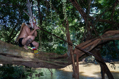 A man borneo traditional dress man is hunting using traditional weapons