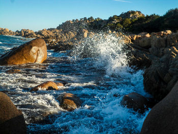 Sea waves splashing on rocks