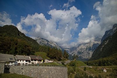 Panoramic view of buildings and mountains against sky