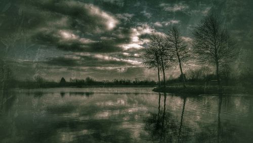 Scenic view of lake against cloudy sky