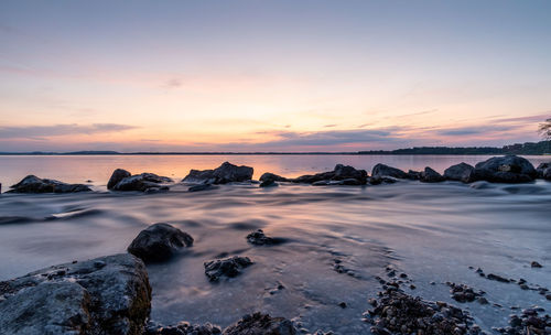 Scenic view of sea against sky during sunset