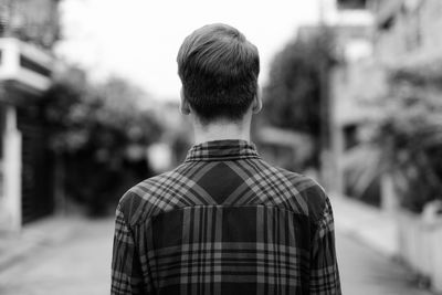 Rear view of man standing on street