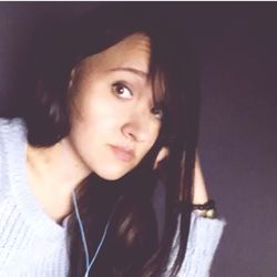 Close-up portrait of smiling young woman