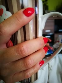 Close-up of hand holding ice cream