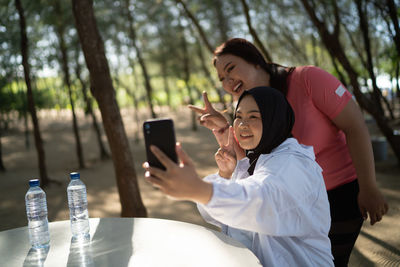 Young woman using mobile phone