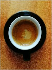 Directly above shot of coffee cup on table