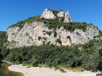 Low angle view of rock formations against sky