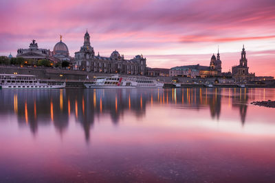 Light and building reflection of elbe river at sunset