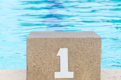 Close-up of text on swimming pool