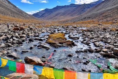 Scenic view of multi colored mountain against sky