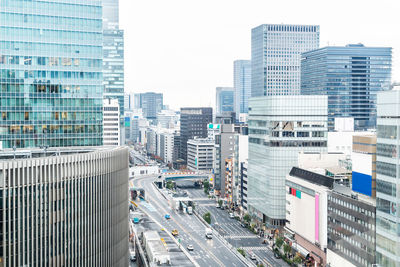 High angle view of city buildings against sky