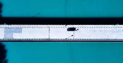 Low angle view of swimming pool against blue sky