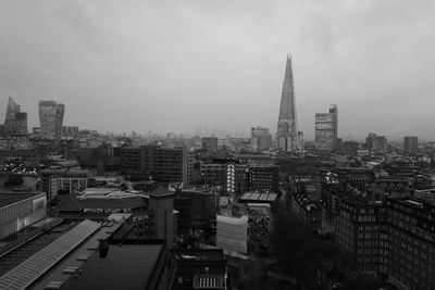 High angle view of buildings in city against sky