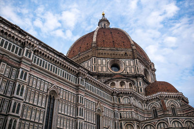 Low angle view of duomo santa maria del fiore against sky in city