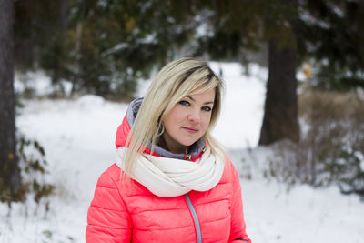 Portrait of woman standing in snow