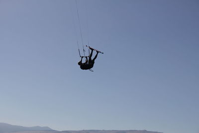 Low angle view of helicopter in sky