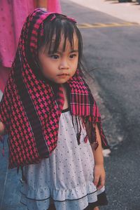 High angle view of girl standing on road