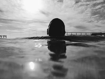 Surface level of swimming pool against sky