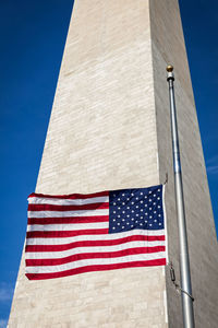 Low angle view of flag against clear sky