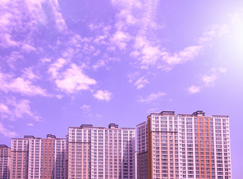 Low angle view of modern buildings against sky