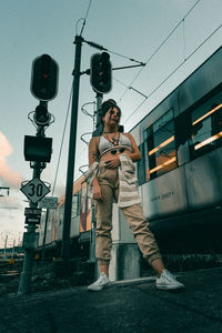 Full length of man photographing against sky