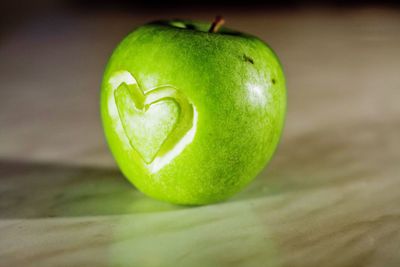 Close-up of heart shape on apple