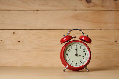 Close-up of clock on wood