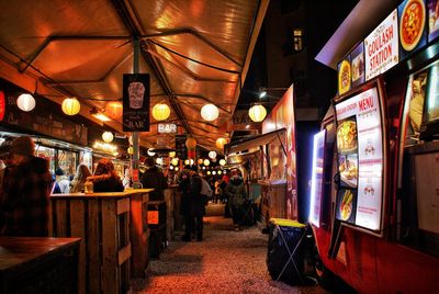 Illuminated market stall at night